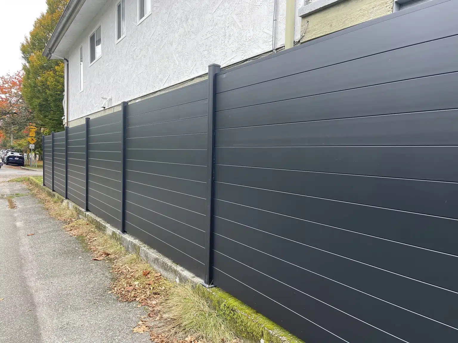 Black metal fence installed by Young Bros in British Columbia